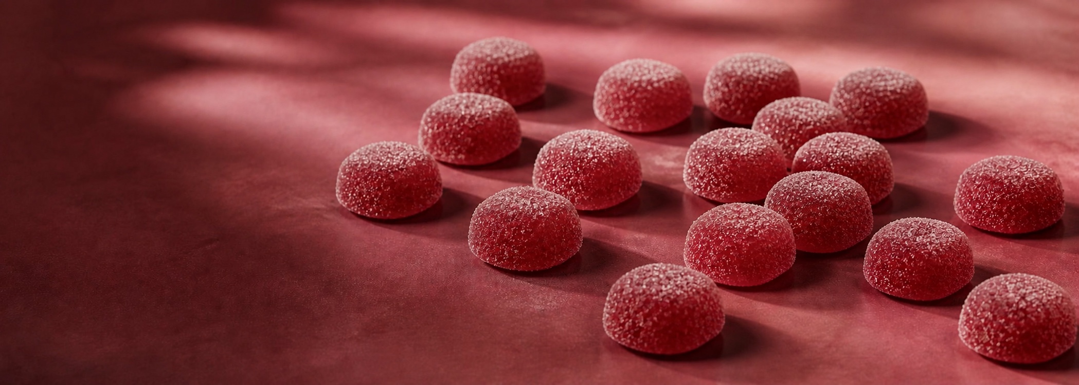 Assortment of symmetrical, sugar-coated Cherry gummies